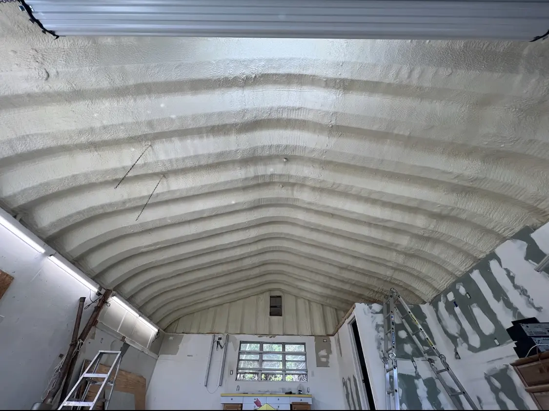 Spray polyurethane foam applied to the underside of a metal roof deck in Fresno
